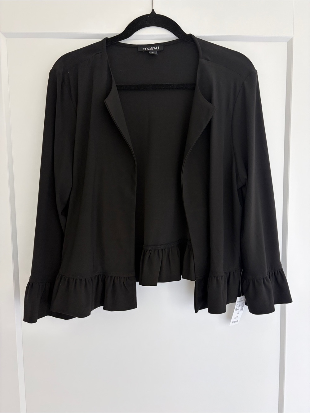 Black Open-Front Ruffle Hem Jacket by TOZGLALI